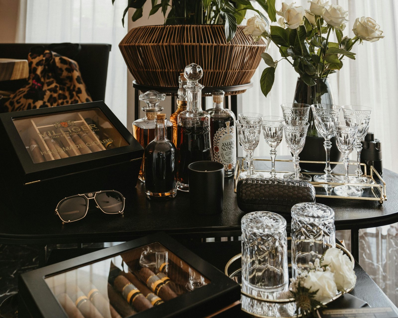 Luxury home bar with crystal decanter, glassware and cigar accessories