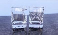 Pair of etched 10.5 oz cigar glasses with a fraternity crest, pale blue backdrop
