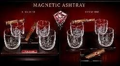Set of cut-crystal whiskey cigar glasses with magnetic ashtray attachments and cigars on a dark backdrop