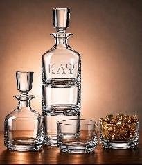Stacking whiskey decanter etched KAP with matching rocks glasses and whiskey on the rocks alongside
