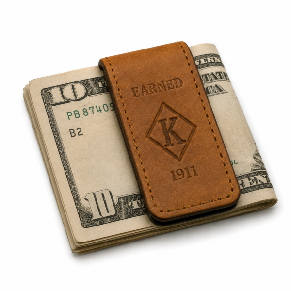 Earned natural leather money clip holding folded currency